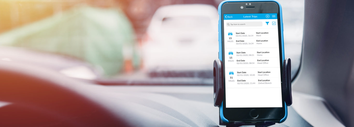 Mobile phone, attached to a cars dashboard with the mileage tracker active.